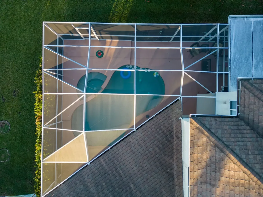 Outdoor living space with pool enclosure